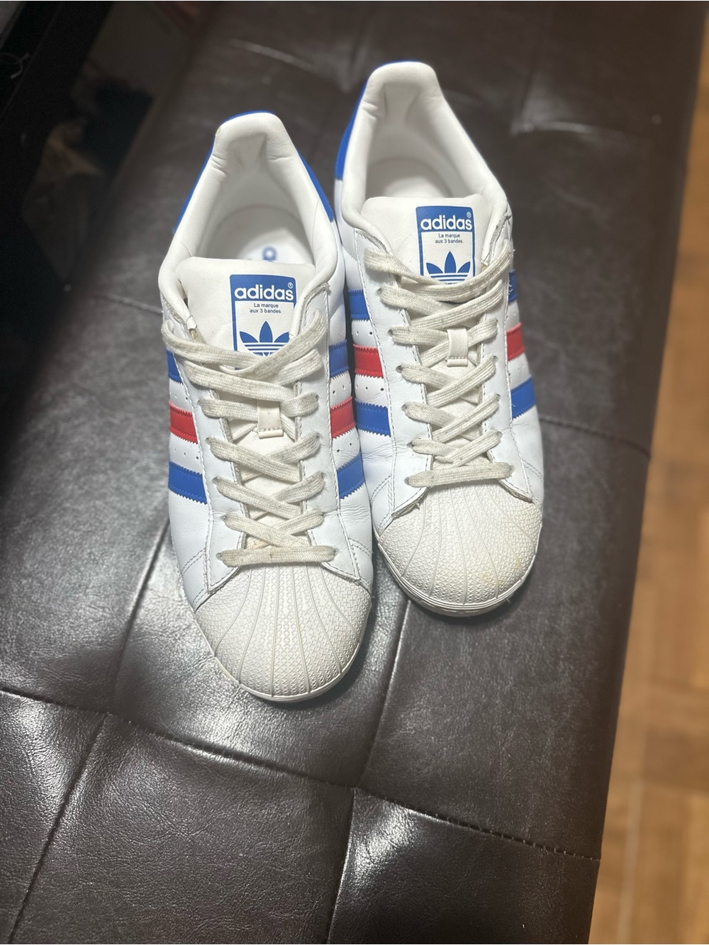 adidas White Sneakers with Blue & Red Stripe Accents